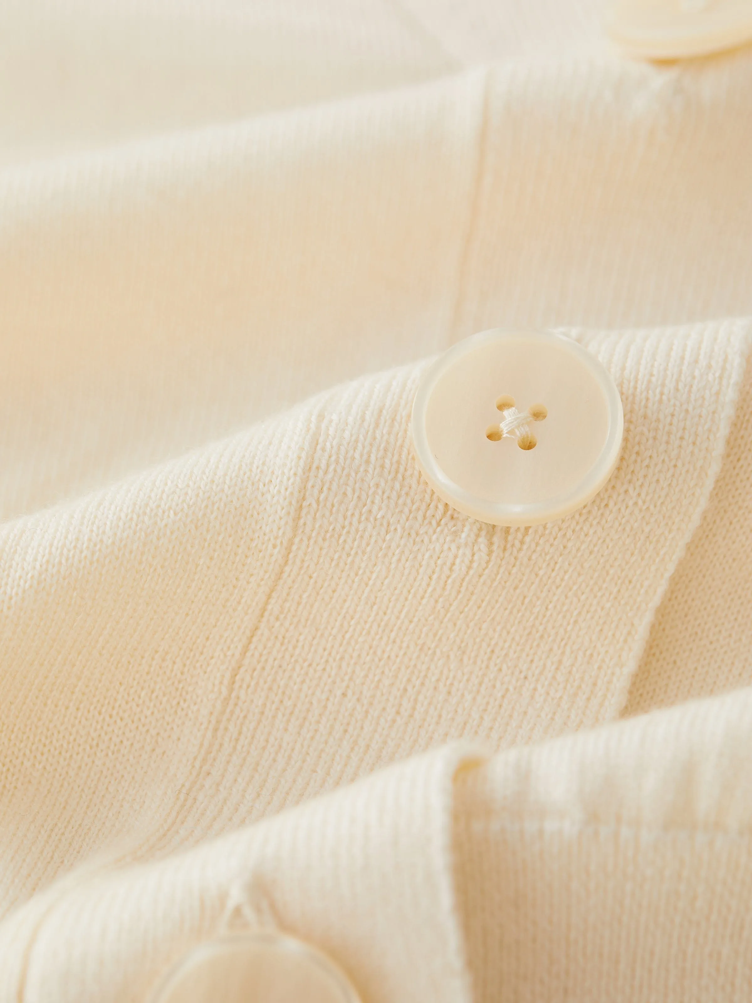 The Merino Wool Collared Cardigan in Antique White